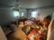 Spacious bedroom with ceiling fan, natural light and traditional decor at 7175 Se 123Rd Pl, Belleview, FL 34420