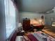 Charming bedroom featuring natural light, wood desk and closet at 7175 Se 123Rd Pl, Belleview, FL 34420