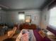 Bright bedroom featuring natural light and a comfortable bed setting at 7175 Se 123Rd Pl, Belleview, FL 34420