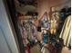 Walk-in closet features ample storage for clothing and shoes at 7175 Se 123Rd Pl, Belleview, FL 34420