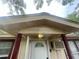 Covered entryway highlighting the front door and architectural details at 7175 Se 123Rd Pl, Belleview, FL 34420