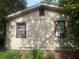Exterior of home with windows and trim, showing the side of the house at 7175 Se 123Rd Pl, Belleview, FL 34420