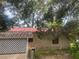 Exterior view of red roof and lattice detailing around the house at 7175 Se 123Rd Pl, Belleview, FL 34420