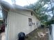 Exterior view highlighting the side of the home's features and utilities at 7175 Se 123Rd Pl, Belleview, FL 34420