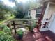 Cozy home with a deck provides a tranquil spot with trees in the background at 7175 Se 123Rd Pl, Belleview, FL 34420
