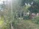 Exterior featuring front deck, landscaped yard, and street view at 7175 Se 123Rd Pl, Belleview, FL 34420
