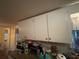 Simple kitchen cabinets offering ample storage space at 7175 Se 123Rd Pl, Belleview, FL 34420