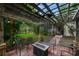 Backyard patio with pergola and fire pit overlooking a well-maintained backyard at 116 Winding Oaks Ln, Oviedo, FL 32765
