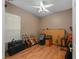Bedroom featuring hardwood floors, a ceiling fan, and a large window at 116 Winding Oaks Ln, Oviedo, FL 32765