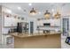 Bright, modern kitchen with stainless steel appliances, granite countertops and ample storage at 116 Winding Oaks Ln, Oviedo, FL 32765