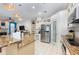 Open kitchen featuring granite counters, stainless steel appliances, and white cabinetry at 116 Winding Oaks Ln, Oviedo, FL 32765