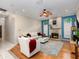 Cozy living room with fireplace, fan, and ample seating perfect for relaxation at 116 Winding Oaks Ln, Oviedo, FL 32765