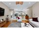 Open-concept living room, seamlessly connecting to the kitchen and dining area, great for entertaining at 116 Winding Oaks Ln, Oviedo, FL 32765