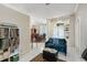 Inviting living room showcasing tile floors, a cozy couch, and abundant natural light at 116 Winding Oaks Ln, Oviedo, FL 32765