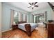 Spacious main bedroom with sliding door access to the screened lanai at 116 Winding Oaks Ln, Oviedo, FL 32765