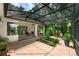 Screened patio surrounded by lush backyard landscaping at 116 Winding Oaks Ln, Oviedo, FL 32765