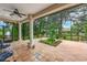 Screened patio with ceiling fan and decorative tile flooring overlooks the backyard at 116 Winding Oaks Ln, Oviedo, FL 32765