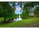 The community boasts a scenic pond with a fountain, surrounded by lush greenery at 116 Winding Oaks Ln, Oviedo, FL 32765