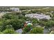 Aerial view of a neighborhood with mature trees and a modern building in the background at 530 S Eola Dr, Orlando, FL 32801
