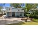 Backyard with a spacious patio, fire pit, and lush landscaping at 530 S Eola Dr, Orlando, FL 32801