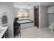 Bathroom with soaking tub, walk-in shower, and neutral color palette at 530 S Eola Dr, Orlando, FL 32801