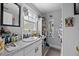 Bright bathroom featuring a large mirror, vanity, and ample storage space at 530 S Eola Dr, Orlando, FL 32801