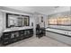 Bathroom features double sink vanity, soaking tub, and modern finishes at 530 S Eola Dr, Orlando, FL 32801