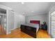Bedroom with hardwood floors, closet, and neutral wall paint at 530 S Eola Dr, Orlando, FL 32801