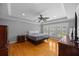 Bright bedroom featuring hardwood floors, trey ceiling, fan and large bright windows at 530 S Eola Dr, Orlando, FL 32801