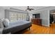 Spacious bedroom features hardwood floors, trey ceiling, fan and a large window at 530 S Eola Dr, Orlando, FL 32801