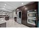 Modern kitchen with stainless steel appliances and rich, dark cabinetry at 530 S Eola Dr, Orlando, FL 32801