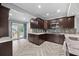Bright kitchen featuring modern cabinets, tiled backsplash, and herringbone-patterned floors at 530 S Eola Dr, Orlando, FL 32801