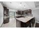 Stylish kitchen boasts dark wood cabinets, a marble countertop, and stainless steel appliances at 530 S Eola Dr, Orlando, FL 32801