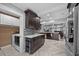 Open kitchen with modern cabinetry, prep island, and herringbone flooring at 530 S Eola Dr, Orlando, FL 32801
