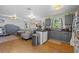 Open-concept living area with hardwood floors flows to the kitchen with gray cabinets at 530 S Eola Dr, Orlando, FL 32801