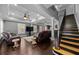 Spacious living room features a staircase, hardwood floors, and a ceiling fan at 530 S Eola Dr, Orlando, FL 32801