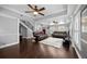 Inviting living room with hardwood floors, ceiling fans, and views of the adjacent kitchen at 530 S Eola Dr, Orlando, FL 32801