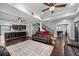Open concept living area features hardwood floors, ceiling fans and stairs at 530 S Eola Dr, Orlando, FL 32801
