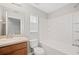 Bright bathroom with a vanity, mirror, toilet, and shower-tub combination at 4034 Winding Vine Dr, Lakeland, FL 33812