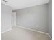Neutral bedroom featuring plush carpet, white trim, and an access door at 4034 Winding Vine Dr, Lakeland, FL 33812