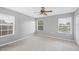 Bright bedroom filled with natural light from three windows at 4034 Winding Vine Dr, Lakeland, FL 33812