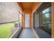 Enclosed patio with large glass sliding door and screened windows at 4034 Winding Vine Dr, Lakeland, FL 33812