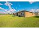 Large backyard with lush grass and a play area perfect for outdoor fun at 4710 Osprey Way, Winter Haven, FL 33881