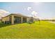 Expansive backyard offers plenty of space for recreation, complete with a playset and screened-in patio at 4710 Osprey Way, Winter Haven, FL 33881