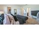Bright bedroom featuring a comfortable bed, soft carpet, and an en-suite bathroom for added convenience at 4710 Osprey Way, Winter Haven, FL 33881