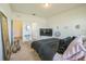 Spacious bedroom featuring a cozy bed, soft carpet, and minimalist decor for a relaxing retreat at 4710 Osprey Way, Winter Haven, FL 33881