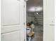 View into garage with an electric door, bike, fan, boxes, and storage at 4710 Osprey Way, Winter Haven, FL 33881