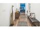 Inviting hallway featuring stylish decor, wood floors, and a glimpse into the home's living spaces at 4710 Osprey Way, Winter Haven, FL 33881
