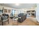 Open-concept living room featuring plush seating, stylish decor, and seamless flow into the modern kitchen at 4710 Osprey Way, Winter Haven, FL 33881