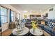 Open-concept living room featuring plush furniture, stylish decor, and seamless access to the kitchen at 4710 Osprey Way, Winter Haven, FL 33881